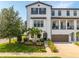 Beautiful two-story home featuring a well-manicured front yard and a two car garage at 2110 W Azeele St, Tampa, FL 33606
