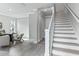 Hallway featuring a staircase with wood treads and modern plank flooring at 2110 W Azeele St, Tampa, FL 33606