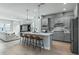 Open concept kitchen features a large island, stainless steel appliances, and sleek cabinets at 2110 W Azeele St, Tampa, FL 33606