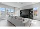 Bright living room with a large built-in entertainment center and lots of natural light at 2110 W Azeele St, Tampa, FL 33606