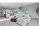 Modern living room with an expansive sectional sofa, hardwood floors and ample natural light at 2110 W Azeele St, Tampa, FL 33606