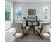 Bright home office featuring two large windows, modern decor, and wood flooring at 2110 W Azeele St, Tampa, FL 33606