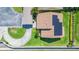 Aerial view showcases the roof's solar panels and circular driveway at 2211 Bay Berry Ln, Clearwater, FL 33763