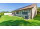 Well-maintained backyard featuring lush green grass and mature landscaping providing privacy at 2211 Bay Berry Ln, Clearwater, FL 33763
