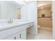 Well-lit bathroom with a sink vanity and a walk-in shower featuring custom tile work at 2211 Bay Berry Ln, Clearwater, FL 33763