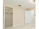 Spacious bedroom with tile flooring, neutral walls, and a walk-in closet for ample storage at 2211 Bay Berry Ln, Clearwater, FL 33763