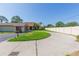 Charming single-story home with well-manicured lawn and a circular driveway at 2211 Bay Berry Ln, Clearwater, FL 33763