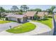 Charming single-story home with well-manicured lawn and a circular driveway at 2211 Bay Berry Ln, Clearwater, FL 33763