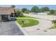 Charming single-story home with well-manicured lawn and a circular driveway at 2211 Bay Berry Ln, Clearwater, FL 33763