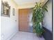 Welcoming front door with sidelight, tiled entry, and decorative mirror at 2211 Bay Berry Ln, Clearwater, FL 33763