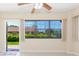 Bright living room with large windows and access to the outdoor patio at 2211 Bay Berry Ln, Clearwater, FL 33763