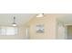 Bright living room showcasing the kitchen bar, front windows, and exterior views at 2211 Bay Berry Ln, Clearwater, FL 33763
