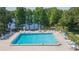 Beautiful community pool surrounded by ample seating and lush landscaping at 2211 Bay Berry Ln, Clearwater, FL 33763