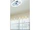 A room featuring a window with blinds and an ornate white valance and a modern ceiling fan at 2211 Bay Berry Ln, Clearwater, FL 33763