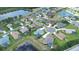 Aerial view of a residential community with cul-de-sacs, ponds, well-manicured lawns, and single-Gathering homes at 2214 132Nd E Pl, Parrish, FL 34219