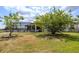 Spacious backyard featuring a screen enclosed lanai, perfect for outdoor living at 2214 132Nd E Pl, Parrish, FL 34219