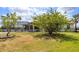 Large backyard with screen enclosed lanai, offering ample space and privacy at 2214 132Nd E Pl, Parrish, FL 34219