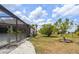 Well-maintained backyard featuring a screen enclosed patio with ample space at 2214 132Nd E Pl, Parrish, FL 34219
