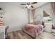 Bedroom with a pink theme, decor and lots of natural light from a large window at 2214 132Nd E Pl, Parrish, FL 34219