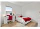 Well-lit bedroom with an office area, white walls and light colored floors at 2214 132Nd E Pl, Parrish, FL 34219