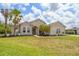 Beautiful single-Gathering home with a manicured lawn, attractive landscaping, and a charming entrance at 2214 132Nd E Pl, Parrish, FL 34219