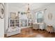 Home office featuring hardwood floors, a built-in bookcase and a bright window at 2214 132Nd E Pl, Parrish, FL 34219