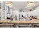 Open kitchen with granite countertops, stainless steel appliances, breakfast bar, and lots of cabinet storage at 2214 132Nd E Pl, Parrish, FL 34219