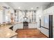 Modern kitchen featuring stainless steel appliances, granite countertops, white cabinets, and decorative backsplash at 2214 132Nd E Pl, Parrish, FL 34219