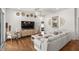 Bright living room with hardwood floors, white walls and stylish coastal decor throughout at 2214 132Nd E Pl, Parrish, FL 34219