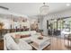 Bright and open living room flowing to the kitchen and screened outdoor patio at 2214 132Nd E Pl, Parrish, FL 34219