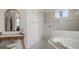 Main bathroom with soaking tub, glass enclosed shower, and vanity area at 2214 132Nd E Pl, Parrish, FL 34219