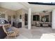 Under-cover outdoor space with grill, seating area, and direct access to the home at 2214 132Nd E Pl, Parrish, FL 34219