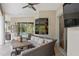 Comfortable outdoor patio seating with wicker furniture and ceiling fan for warm days at 2214 132Nd E Pl, Parrish, FL 34219