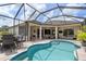 Screened pool area with outdoor dining and seating, perfect for entertaining at 2214 132Nd E Pl, Parrish, FL 34219