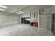 Spacious bonus room with tile floors, built-in shelves, and natural light streaming through large windows at 2333 Camp Indianhead Rd, Land O Lakes, FL 34639