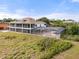 Beautiful home featuring a screened in pool and expansive yard providing the ultimate in privacy and relaxation at 2333 Camp Indianhead Rd, Land O Lakes, FL 34639