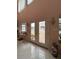 Open foyer features decorative double doors and tile floors; a grand entrance at 2333 Camp Indianhead Rd, Land O Lakes, FL 34639