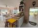 Bright kitchen featuring granite countertops, and an adjacent dining area with scenic views at 2333 Camp Indianhead Rd, Land O Lakes, FL 34639