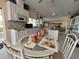 Well-lit open kitchen features island and bar seating with extended countertop space at 2333 Camp Indianhead Rd, Land O Lakes, FL 34639