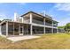 Spacious screened porch with ample seating, offering an inviting outdoor living space with beautiful views at 2333 Camp Indianhead Rd, Land O Lakes, FL 34639