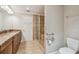 Bathroom with granite counters, updated shower, toilet and fixtures at 2421 Lake Point Ln, Clearwater, FL 33762