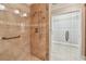 Modern bathroom shower with tile surround, mosaic accents and glass door into large walk in closet at 2421 Lake Point Ln, Clearwater, FL 33762