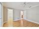 Bedroom with hardwood floors, closet, and entrances to other rooms in a neutral wall color at 2421 Lake Point Ln, Clearwater, FL 33762