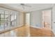 Bedroom with hardwood floors, closet, and entrances to other rooms, with lots of natural light at 2421 Lake Point Ln, Clearwater, FL 33762