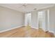 Bedroom with two closets, hardwood floors, and neutral paint at 2421 Lake Point Ln, Clearwater, FL 33762