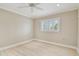Bright bedroom with wood-look flooring and plantation shutters at 2421 Lake Point Ln, Clearwater, FL 33762