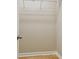 A walk-in closet with hardwood floors and wire rack shelving at 2421 Lake Point Ln, Clearwater, FL 33762