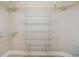 Walk in closet with shelving for organizing your wardrobe at 2421 Lake Point Ln, Clearwater, FL 33762