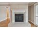 Elegant fireplace featuring a white mantel and tile surround, a focal point in the living area at 2421 Lake Point Ln, Clearwater, FL 33762
