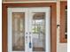 Elegant glass front door with decorative detailing and visible smart doorbell at 2421 Lake Point Ln, Clearwater, FL 33762